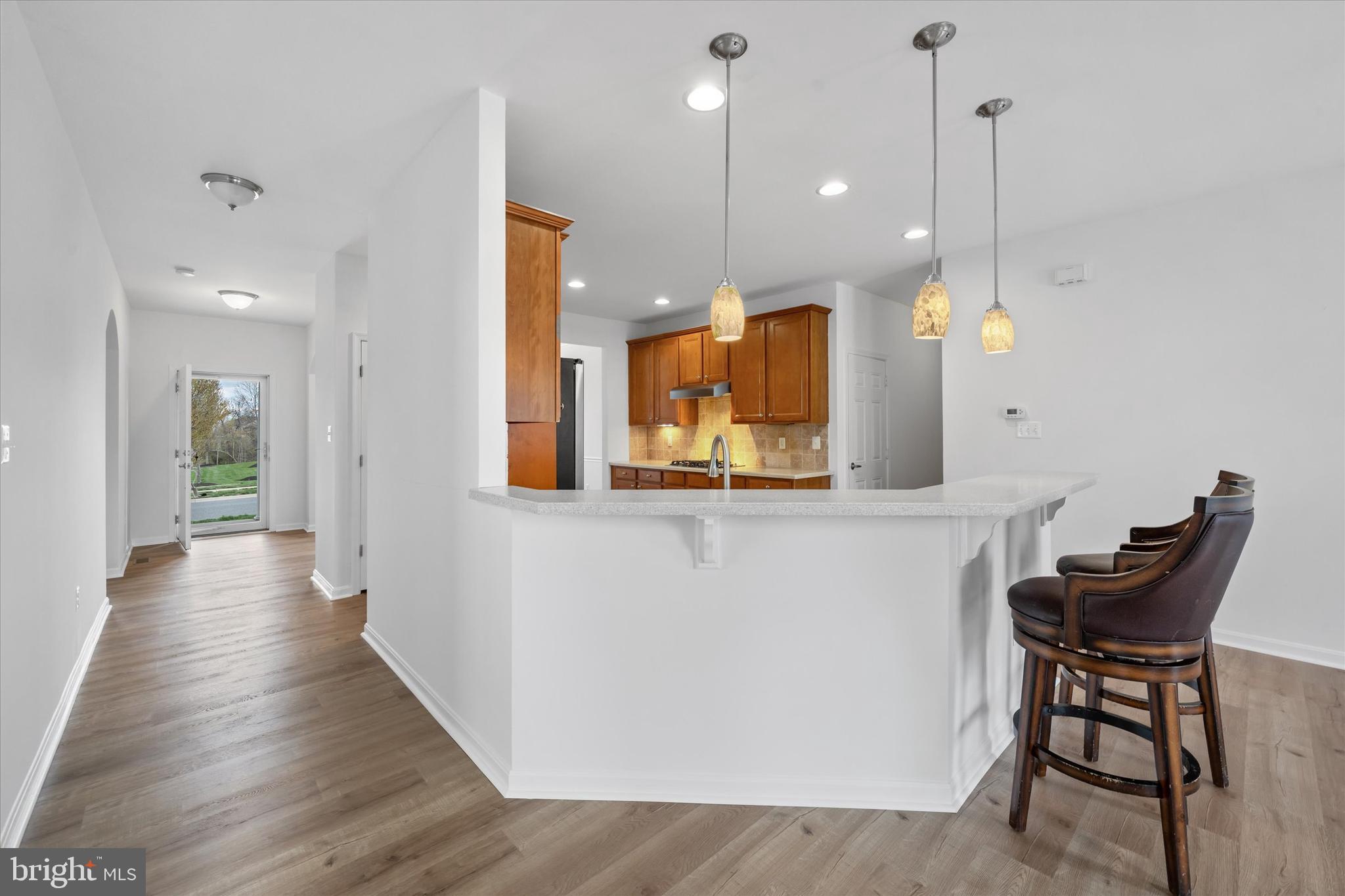 424 Winterberry Drive Middletown, DE 19709 - Photo 15 of 43 a view of a kitchen with dining table and chairs