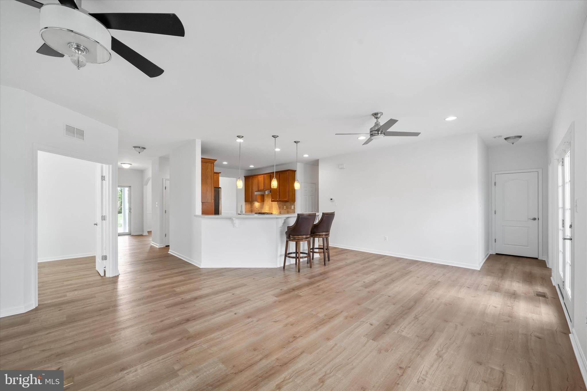 424 Winterberry Drive Middletown, DE 19709 - Photo 16 of 43 a view of livingroom with hardwood floor and a ceiling fan