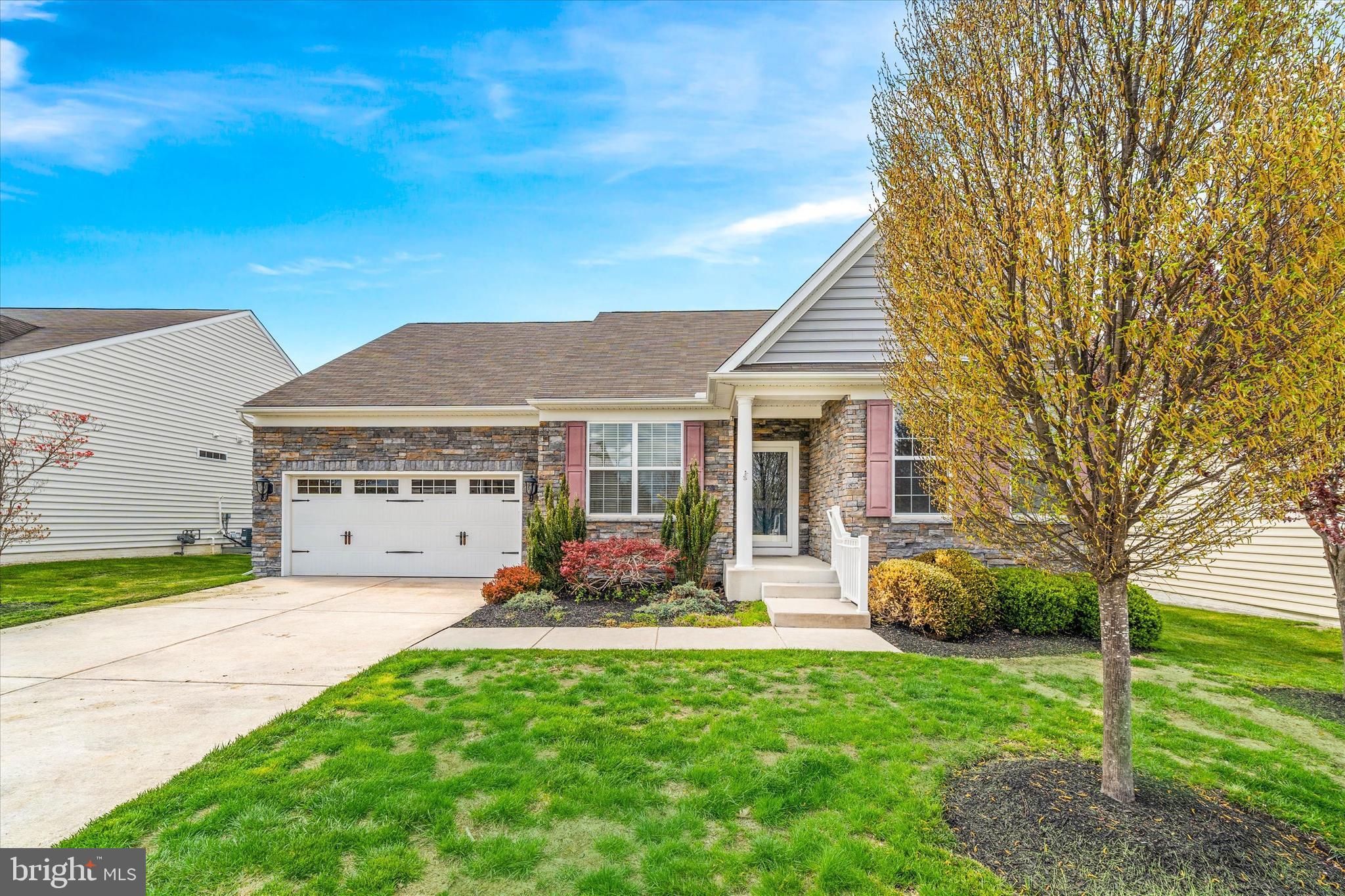 424 Winterberry Drive Middletown, DE 19709 - Photo 2 of 43 a front view of a house with garden