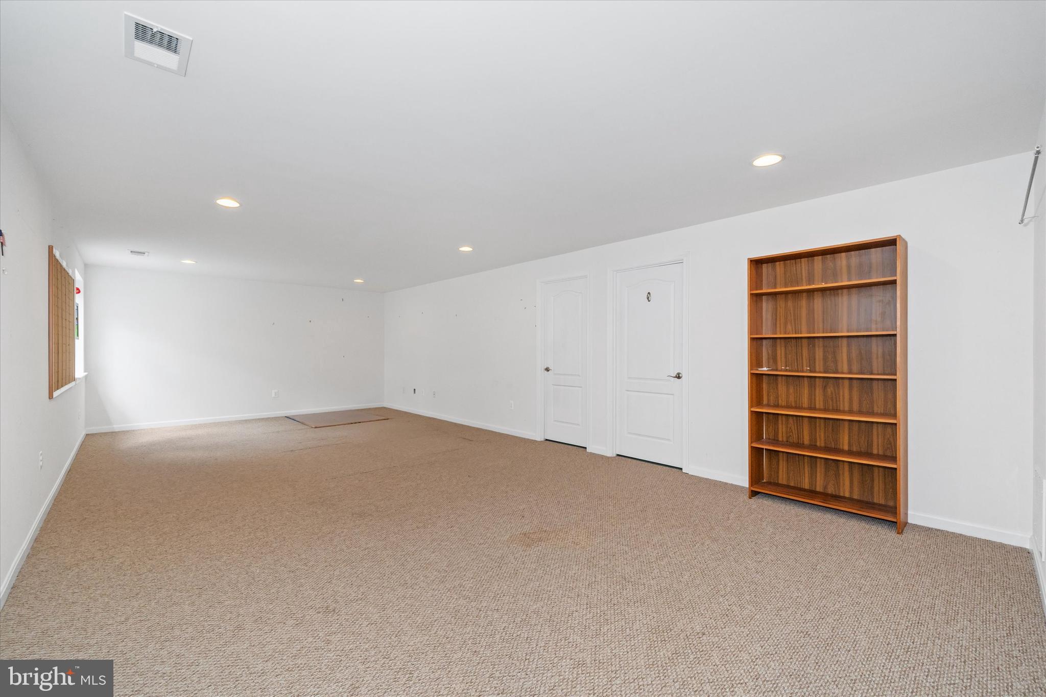 424 Winterberry Drive Middletown, DE 19709 - Photo 30 of 43 a view of an empty room with a closet and cabinet