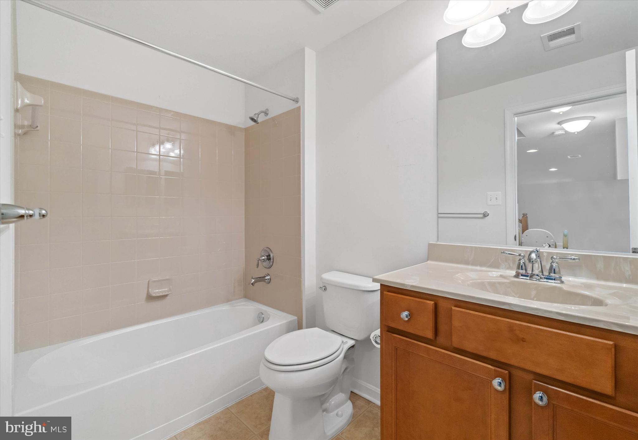 424 Winterberry Drive Middletown, DE 19709 - Photo 34 of 43 a bathroom with a sink a toilet and shower