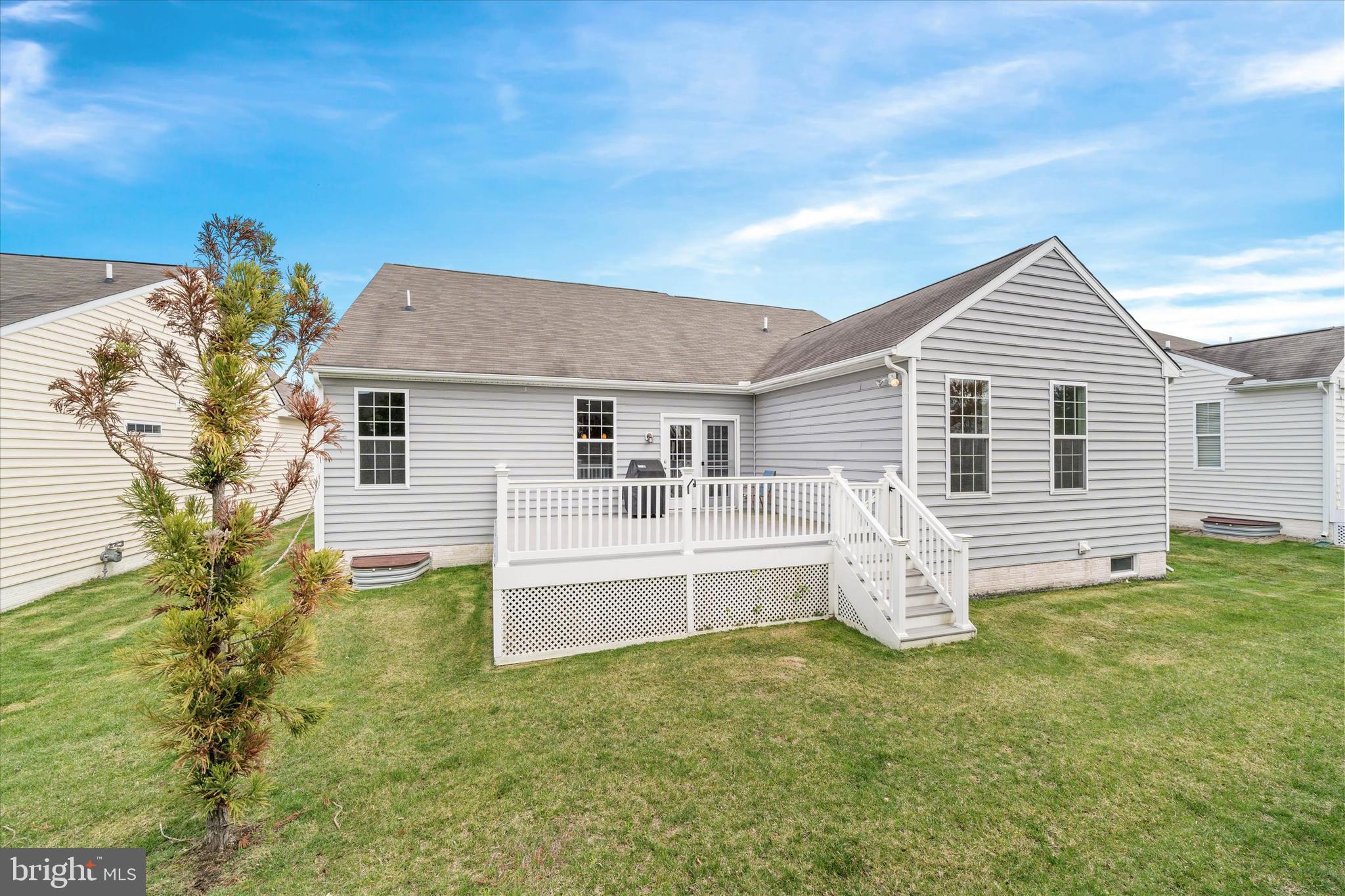424 Winterberry Drive Middletown, DE 19709 - Photo 37 of 43 a front view of a house with a garden