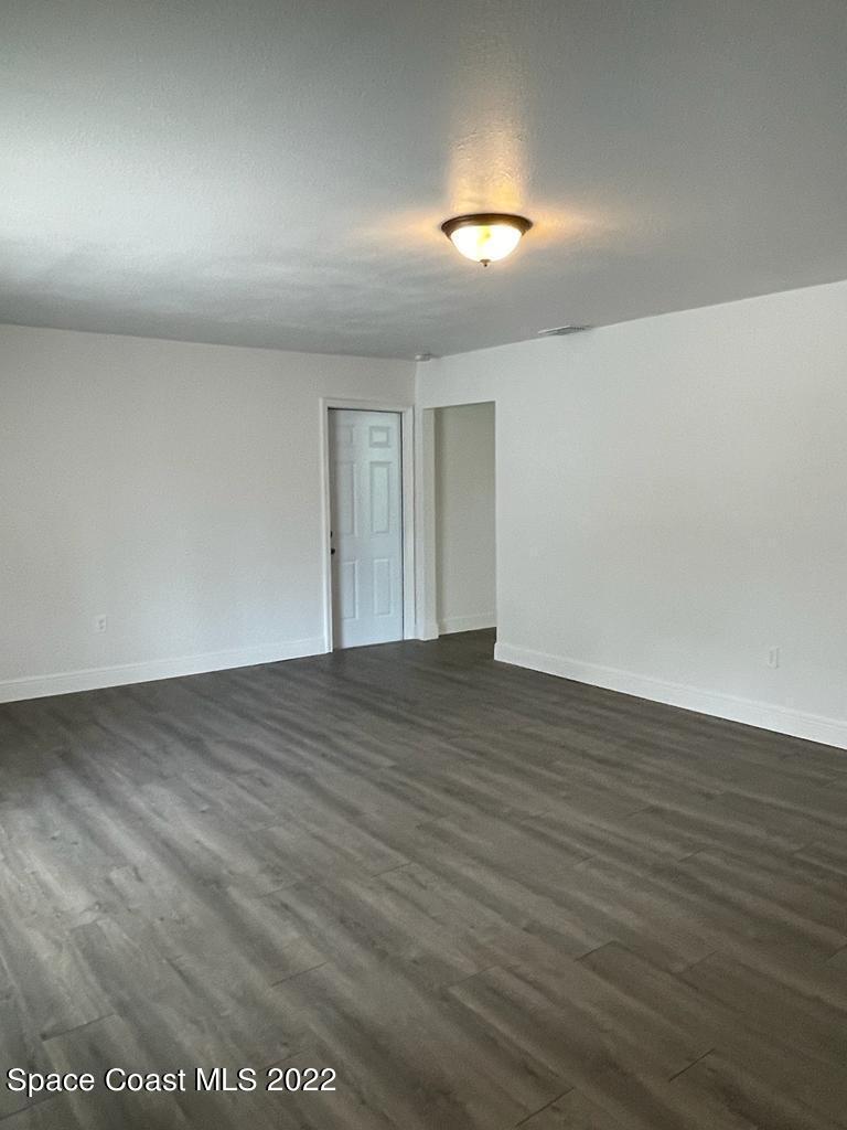2262 Monroe Street Palm Bay, FL 32905 - Photo 6 of 15 a view of empty room with wooden floor