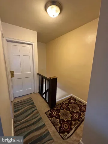 a view of a utility room with wooden floor