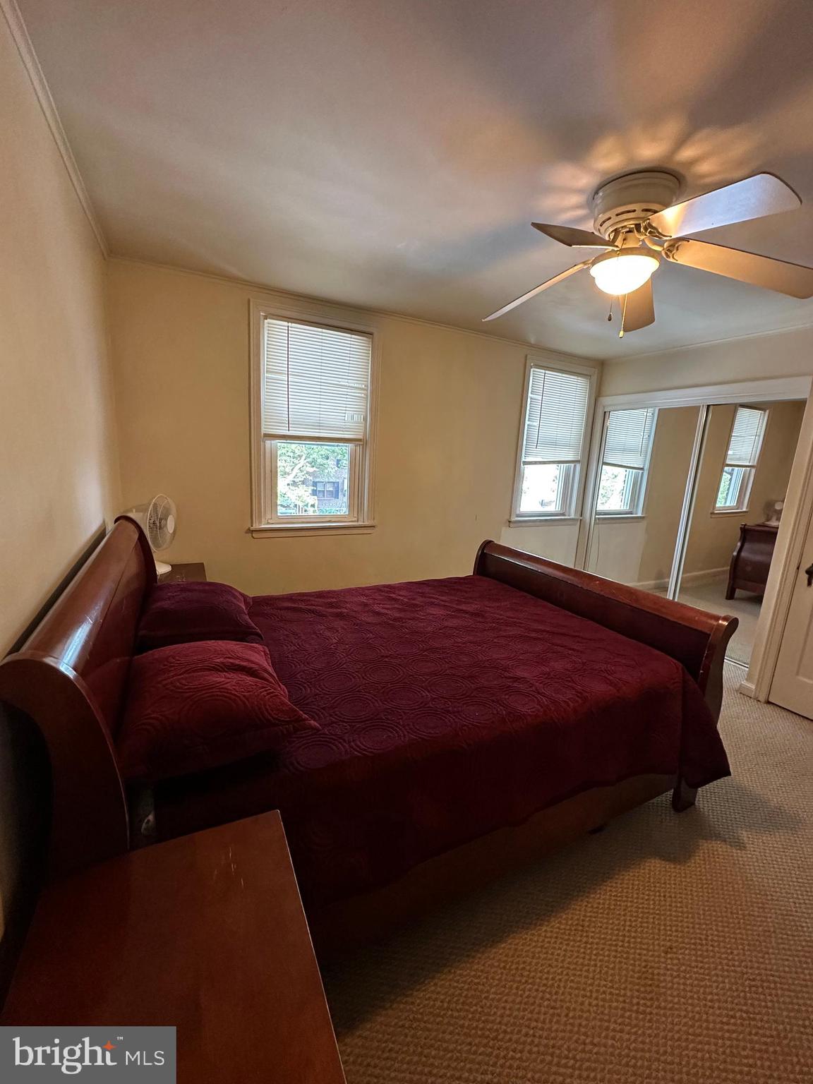 6018 Frontenac Street Philadelphia, PA 19149 - Photo 23 of 30 a bedroom with a bed and a chandelier