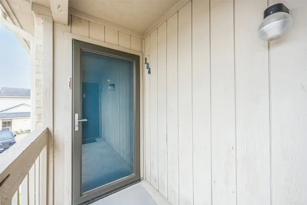 a view of a bathroom from a hallway