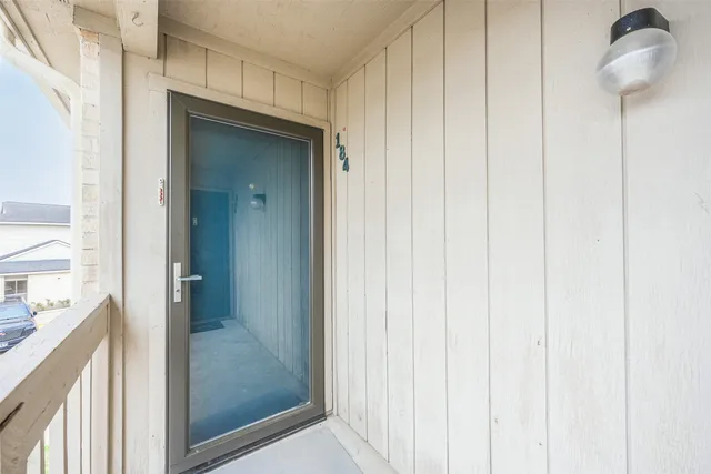 a view of a bathroom from a hallway