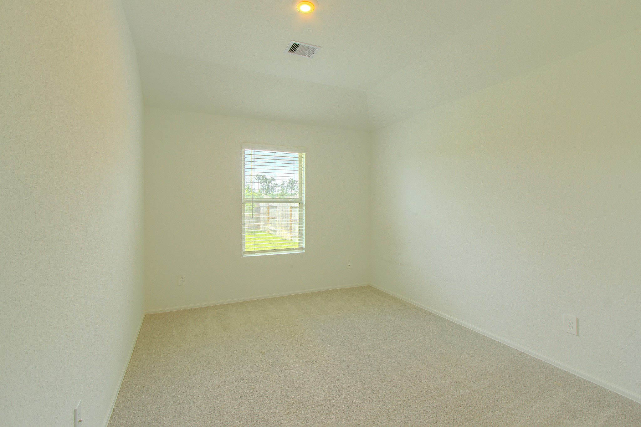 3113 Catalonion Court Conroe, TX 77301 - Photo 27 of 45 an empty room with a window