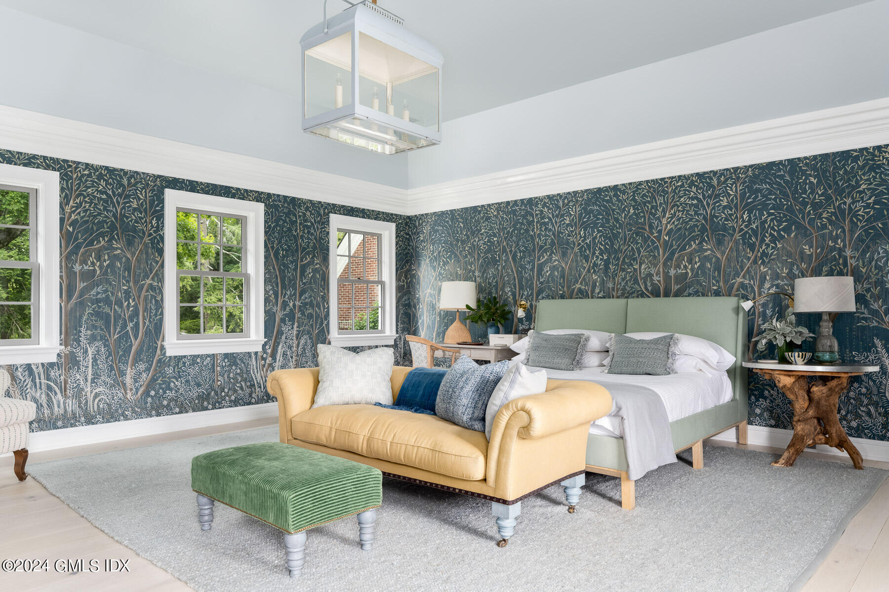 313 Stanwich Road Greenwich, CT 06830 - Photo 16 of 42 a spacious bedroom with a bed a couch and large window