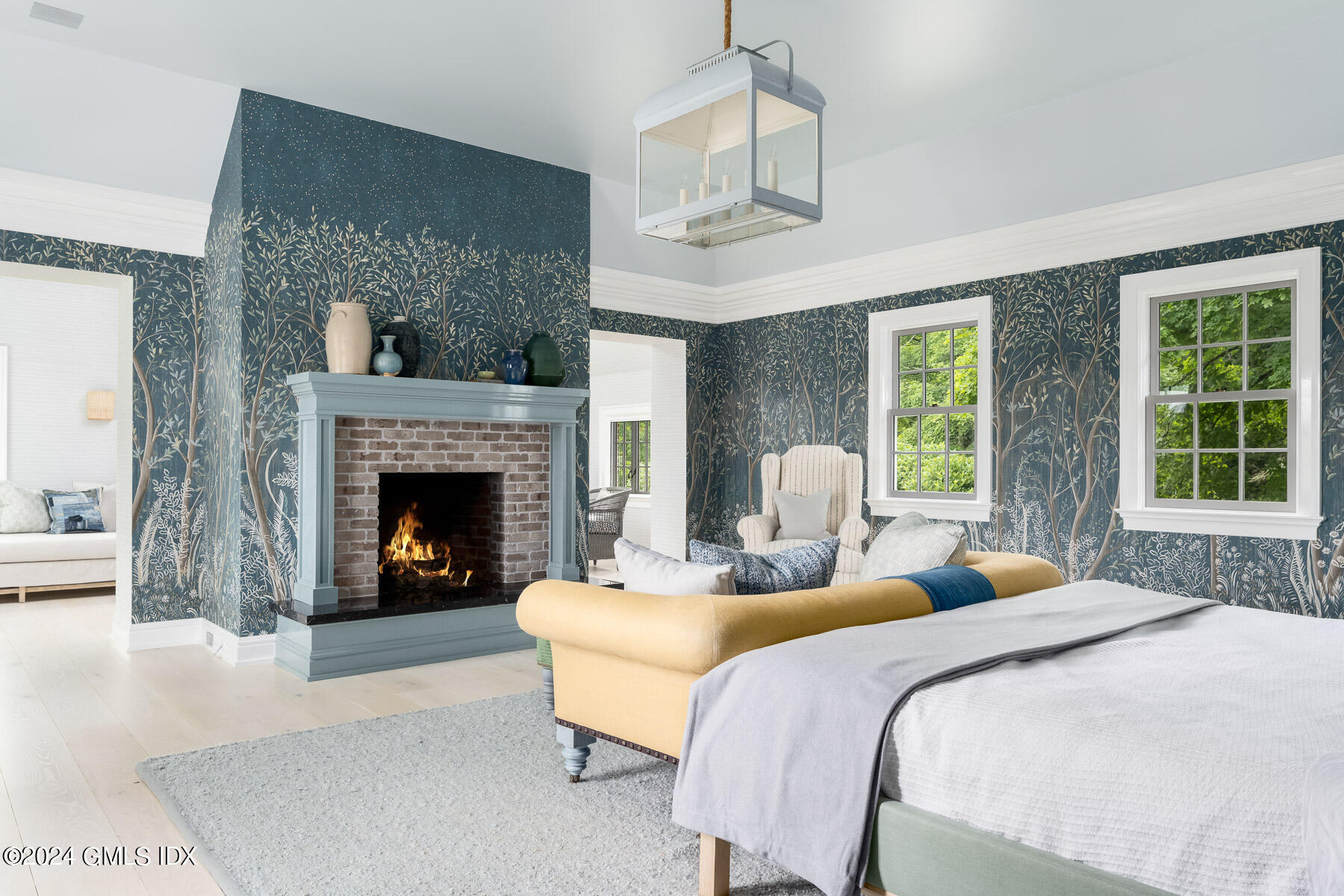 313 Stanwich Road Greenwich, CT 06830 - Photo 17 of 42 a bedroom with a bed and a fireplace