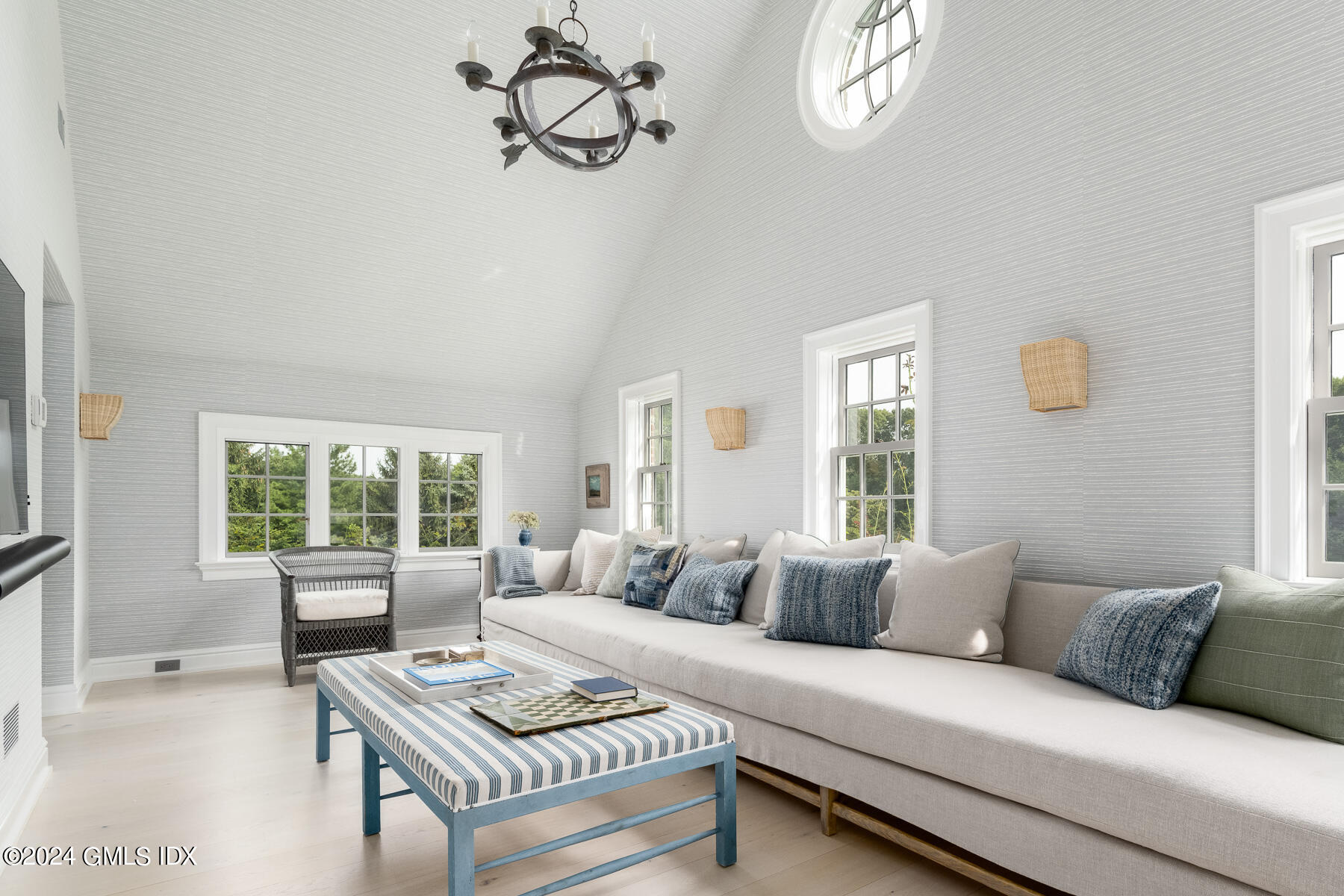 313 Stanwich Road Greenwich, CT 06830 - Photo 18 of 42 a living room with furniture a window and a flat screen tv