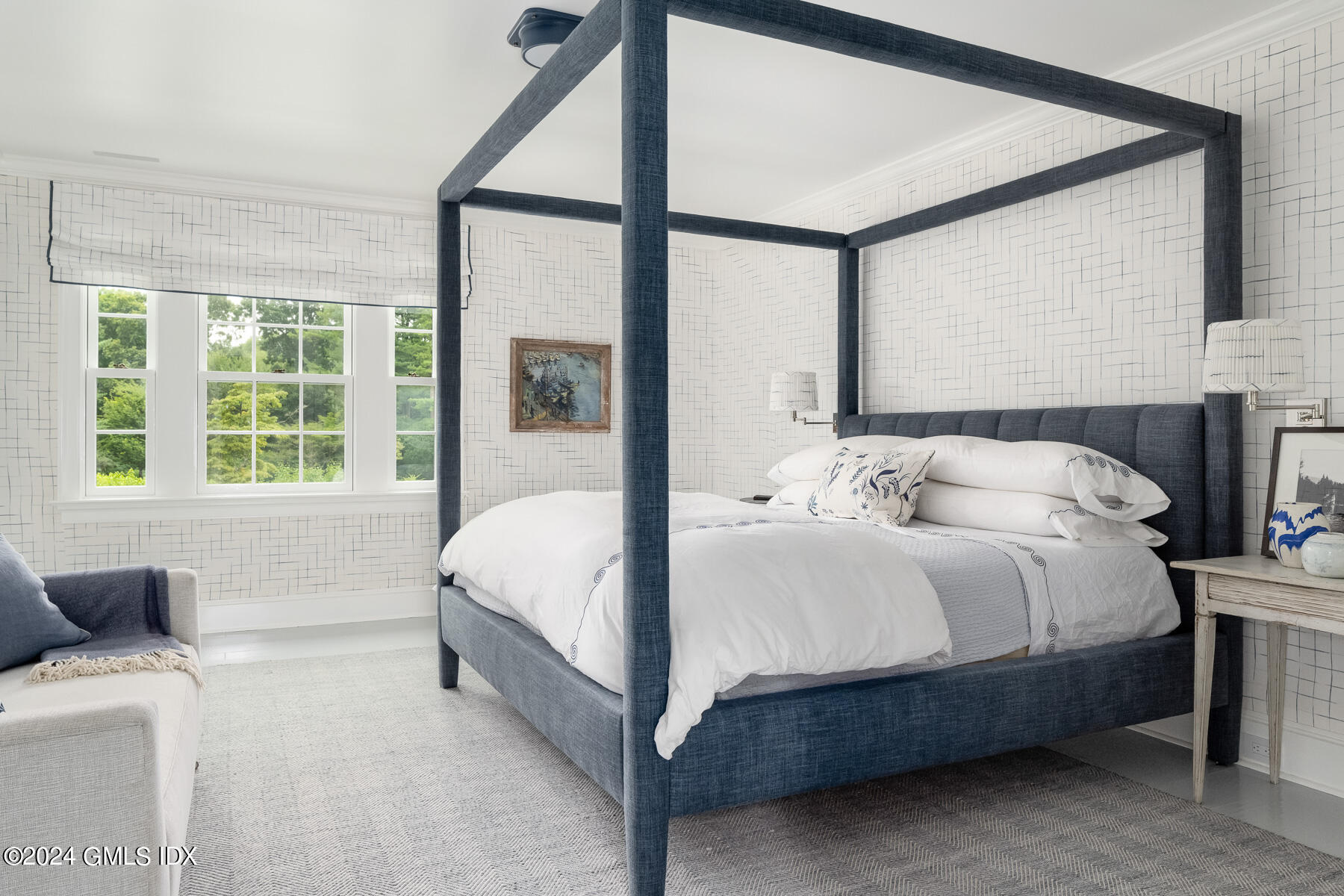 313 Stanwich Road Greenwich, CT 06830 - Photo 20 of 42 a bedroom with a bed lamp and a large window