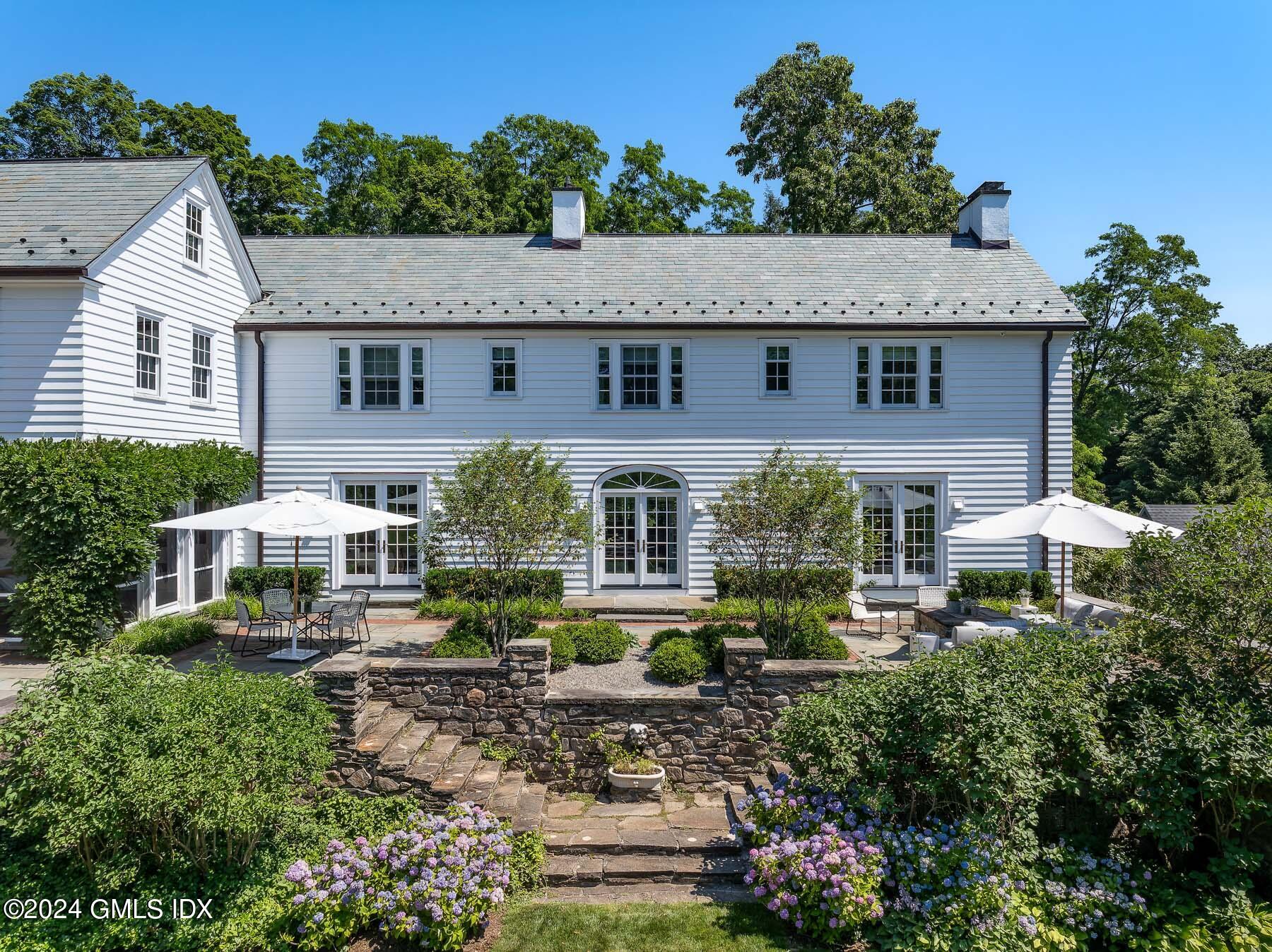 313 Stanwich Road Greenwich, CT 06830 - Photo 29 of 42 front view of a house with a yard