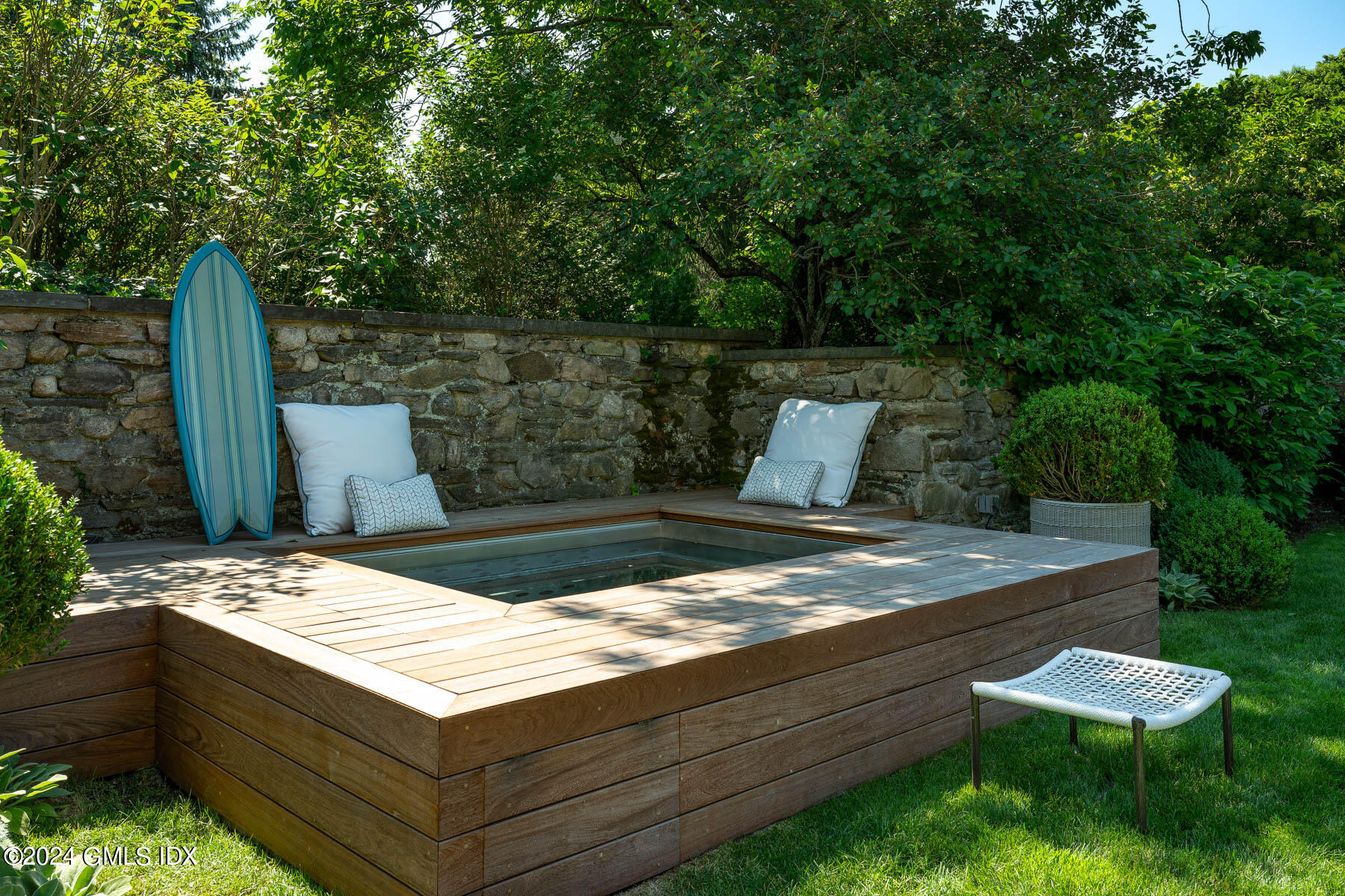 313 Stanwich Road Greenwich, CT 06830 - Photo 31 of 42 a view of sitting area in a backyard