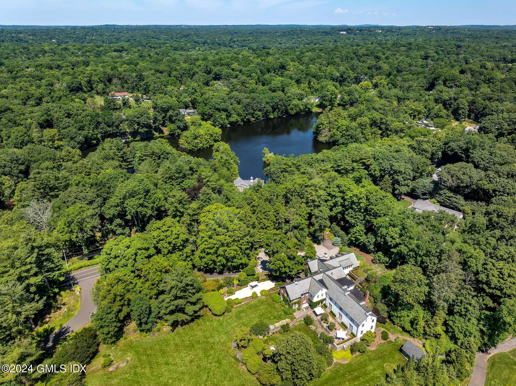 313 Stanwich Road Greenwich, CT 06830 - Photo 42 of 42 a view of a garden with a lake