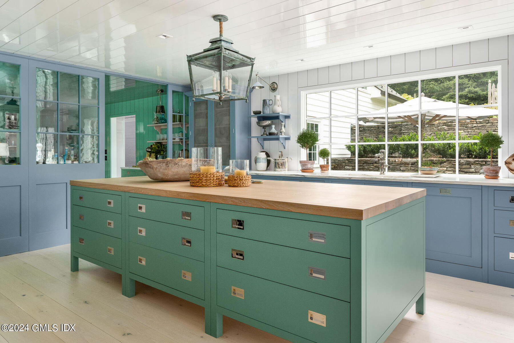 313 Stanwich Road Greenwich, CT 06830 - Photo 7 of 42 a kitchen with a window sink and view of living room