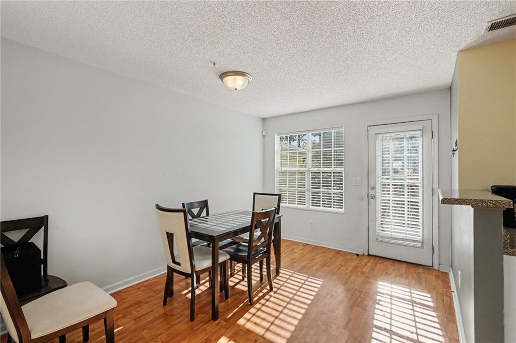 123 Chastain Circle Newnan, GA 30263 - Photo 12 of 27 a view of a room with furniture wooden floor and windows