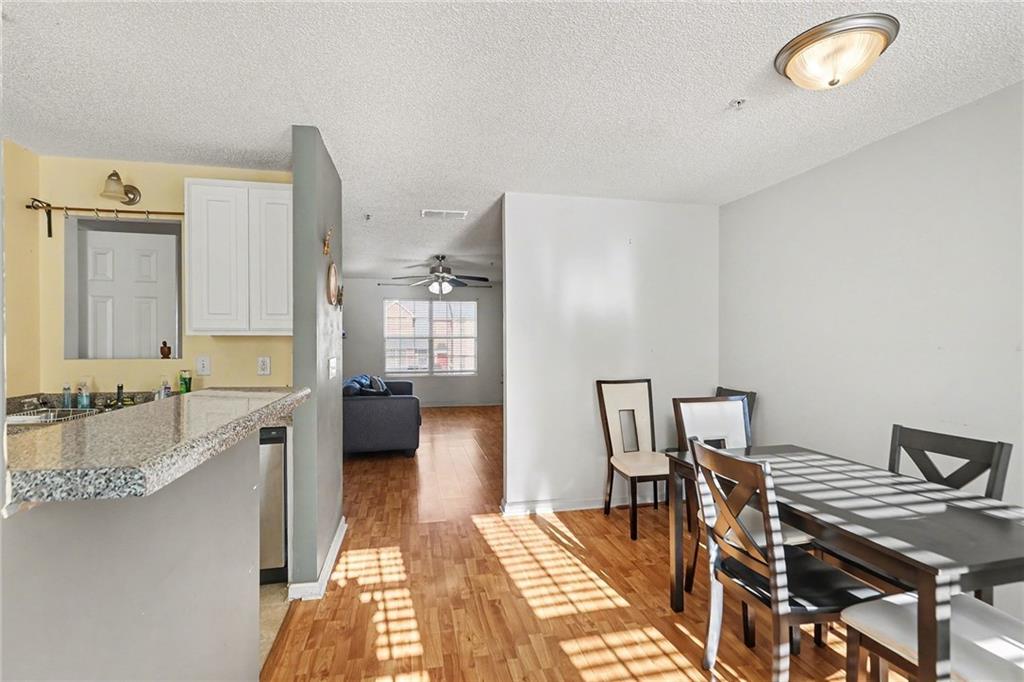 123 Chastain Circle Newnan, GA 30263 - Photo 14 of 27 a spacious bathroom with a granite countertop sink and a mirror