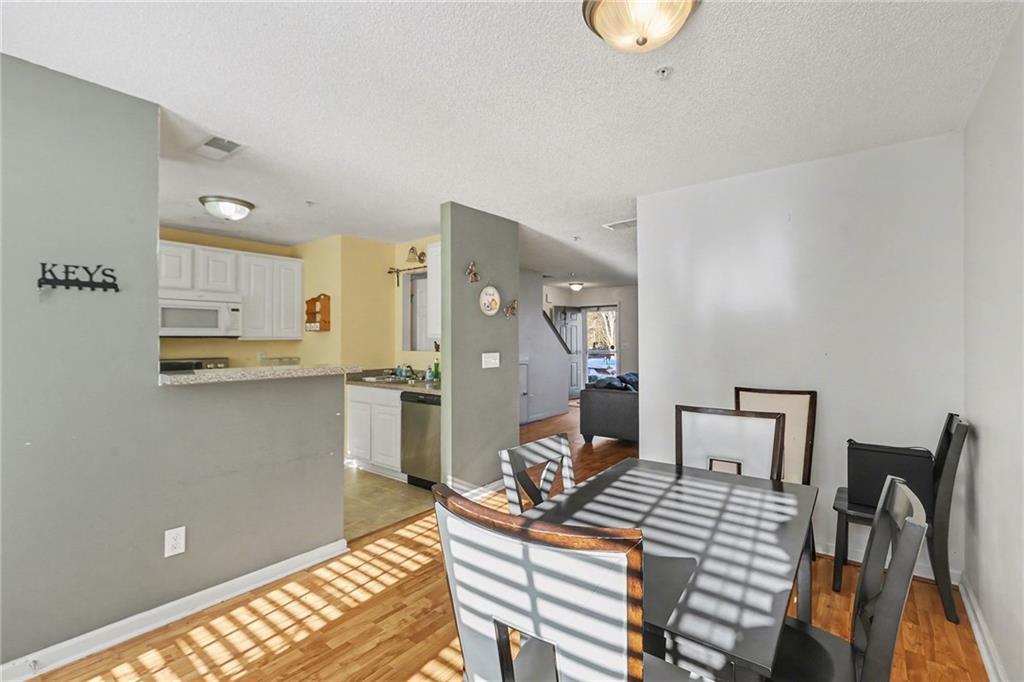 123 Chastain Circle Newnan, GA 30263 - Photo 10 of 27 a workspace with furniture and wooden floor