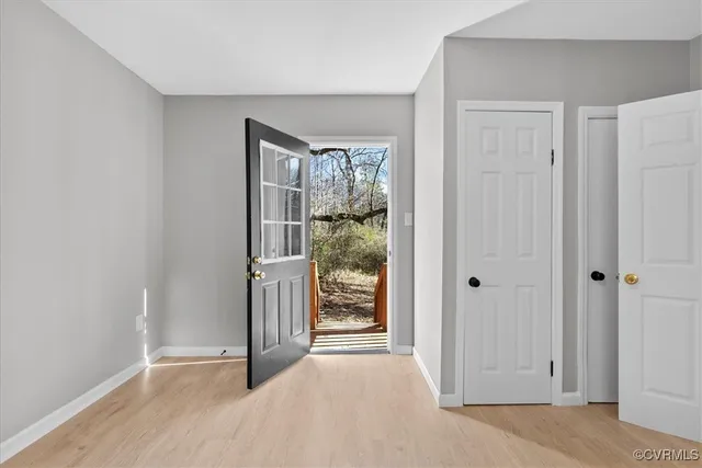 a view of entryway with wooden floor