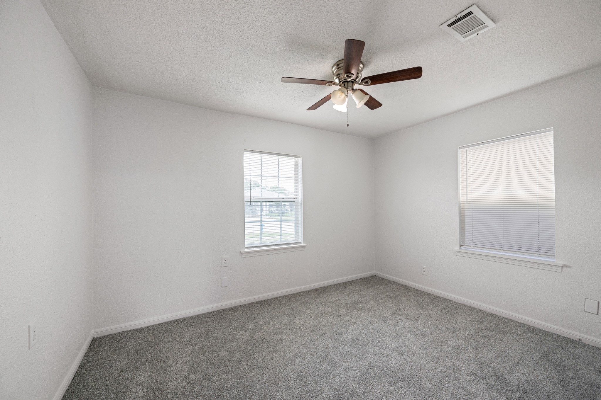 1426 Shawnee Street Houston, TX 77034 - Photo 26 of 34 Second bedroom features soft carpet and a neutral color palette, for a relaxing atmosphere.