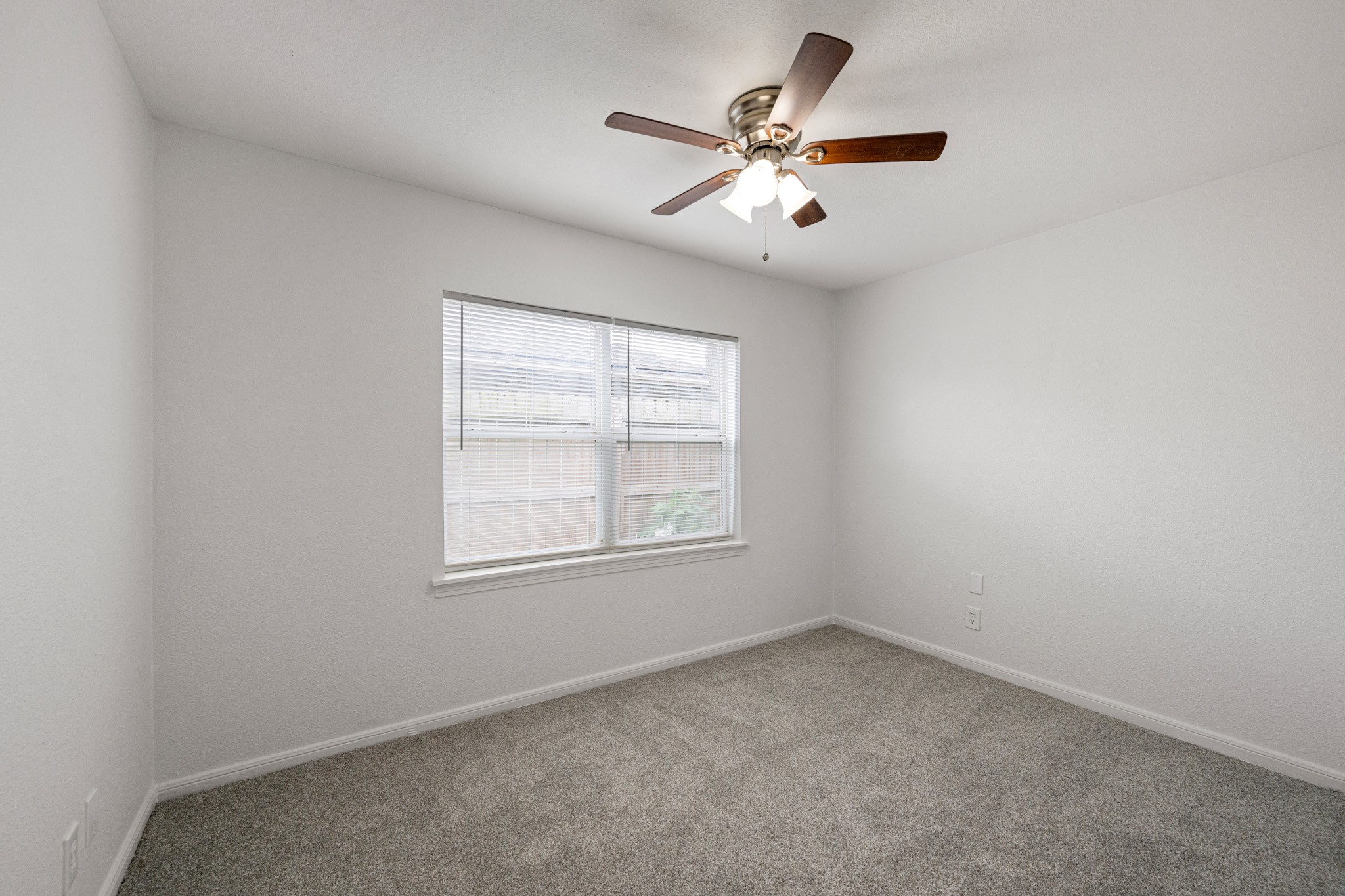 1426 Shawnee Street Houston, TX 77034 - Photo 27 of 34 The third bedroom also features soft carpet and a neutral color palette, for a relaxing atmosphere.