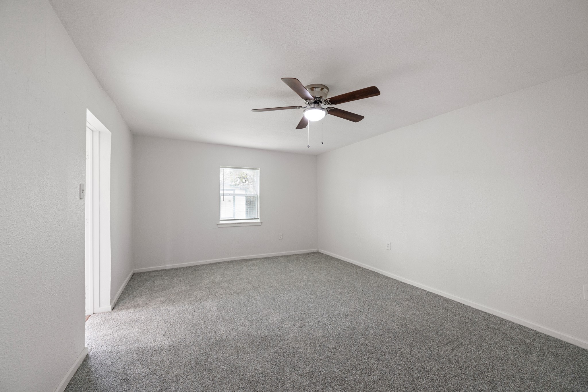 1426 Shawnee Street Houston, TX 77034 - Photo 28 of 34 This spacious fourth bedroom offers tons of possibilities, with ample room to serve as a secondary primary bedroom. Its generous layout allows for a variety of uses, including game room, or home office/study.
