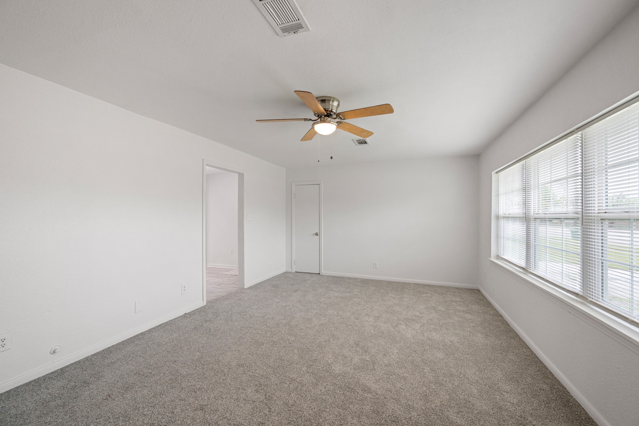 1426 Shawnee Street Houston, TX 77034 - Photo 9 of 34 This inviting living room features neutral tones and natural light that creates a warm and comfortable feel.