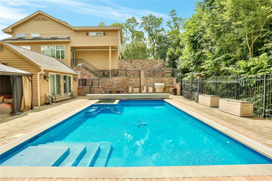 220 Quaker Ridge Road New Rochelle, NY 10804 - Photo 1 of 1 a view of an house with swimming pool