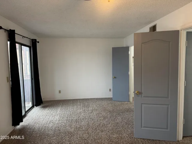a white toilet sitting next to a bath tub