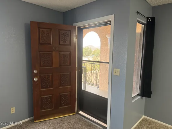 a view of an empty room with a closet