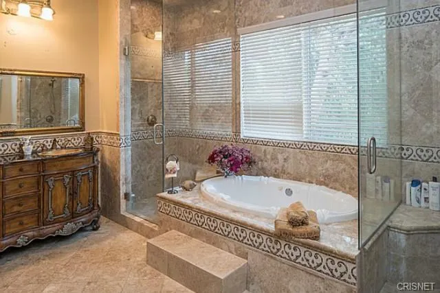 a bathroom with a sink toilet and mirror