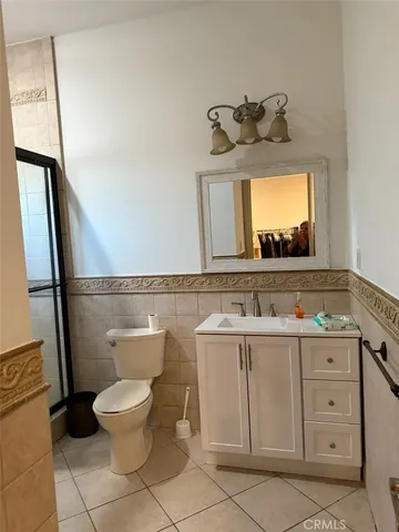 a living room with furniture and a clock