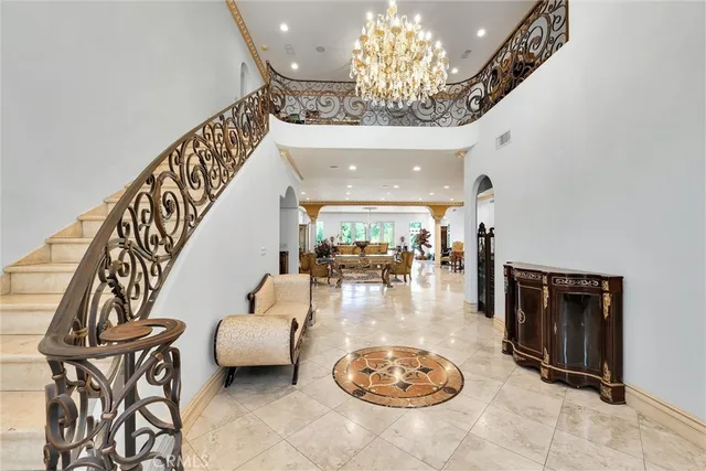 a view of a livingroom with furniture and a chandelier