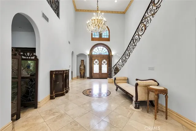 a kitchen with stainless steel appliances granite countertop a sink a stove and a wooden floors
