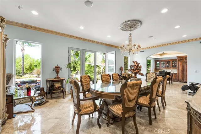 a view of an house with backyard and sitting area