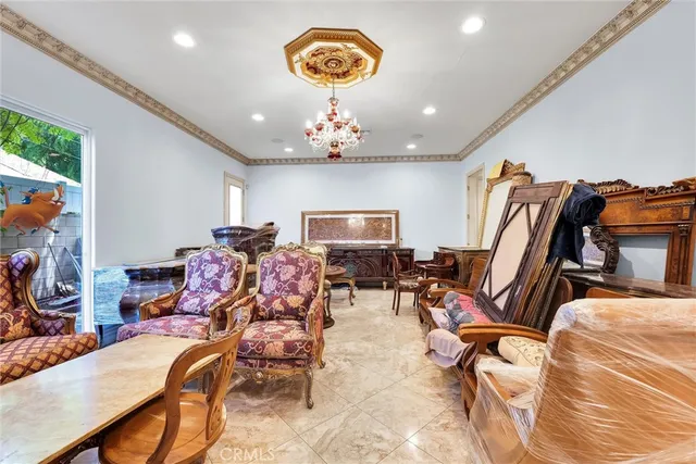 a bed room with a bed and a chair