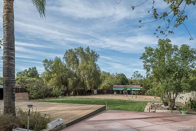 a living room with furniture and a clock