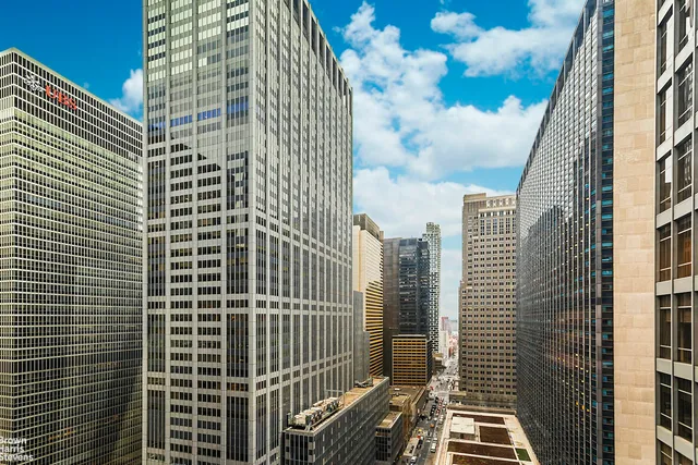 a kitchen with granite countertop a sink and cabinets