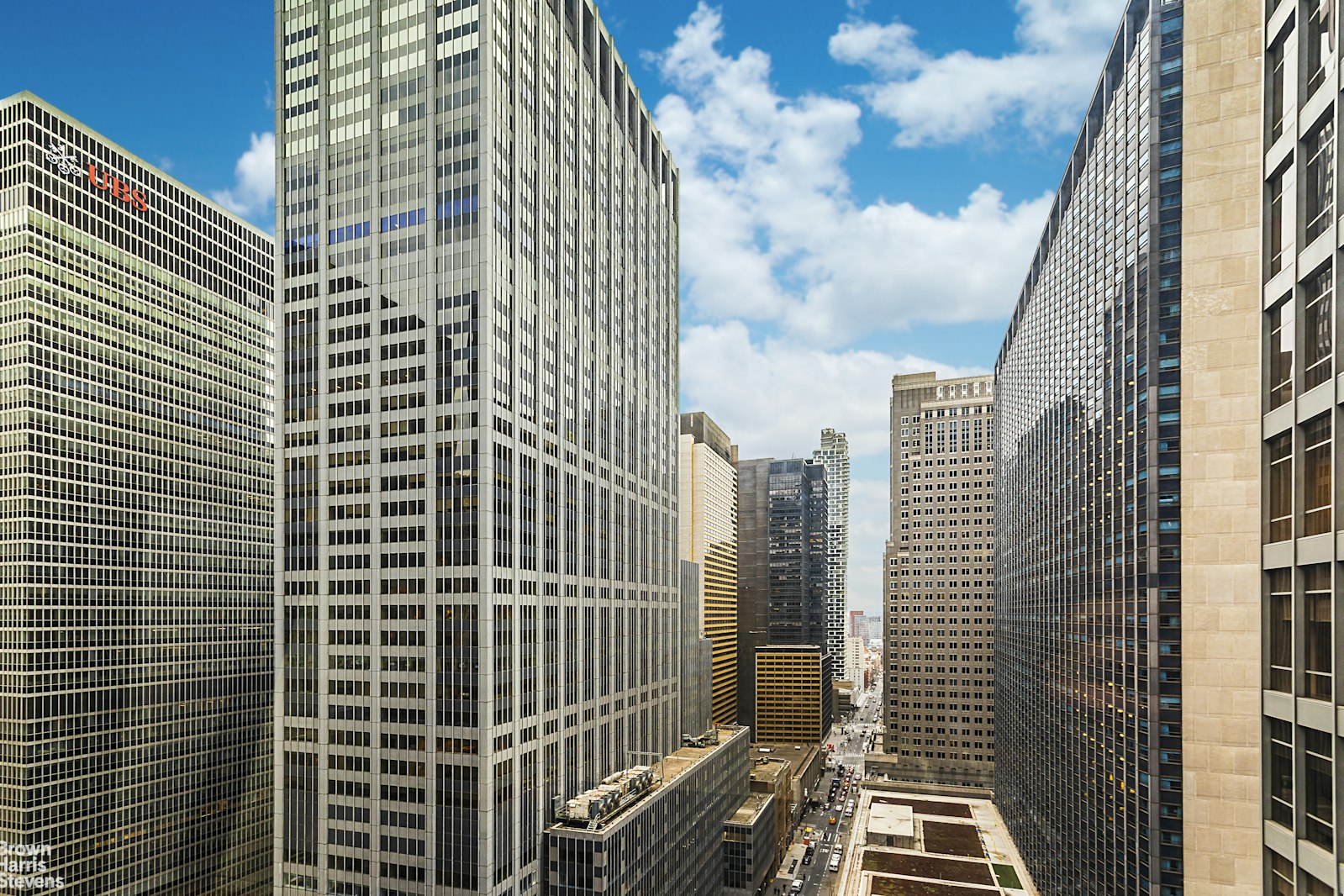 53 West 53rd Street, Unit 24F Manhattan, NY 10019 - Photo 6 of 10 a view of a city with tall buildings