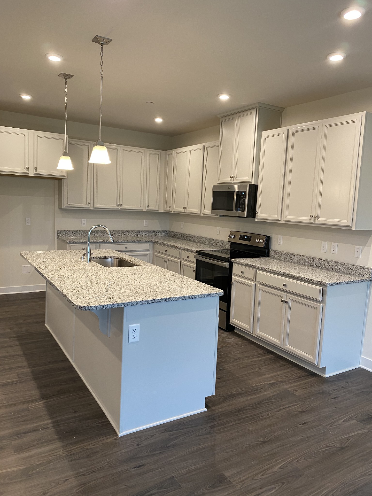 110 Keelon Gap Road, Unit 104C Spring Hill, TN 37174 - Photo 7 of 22 a kitchen with a sink cabinets and wooden floor