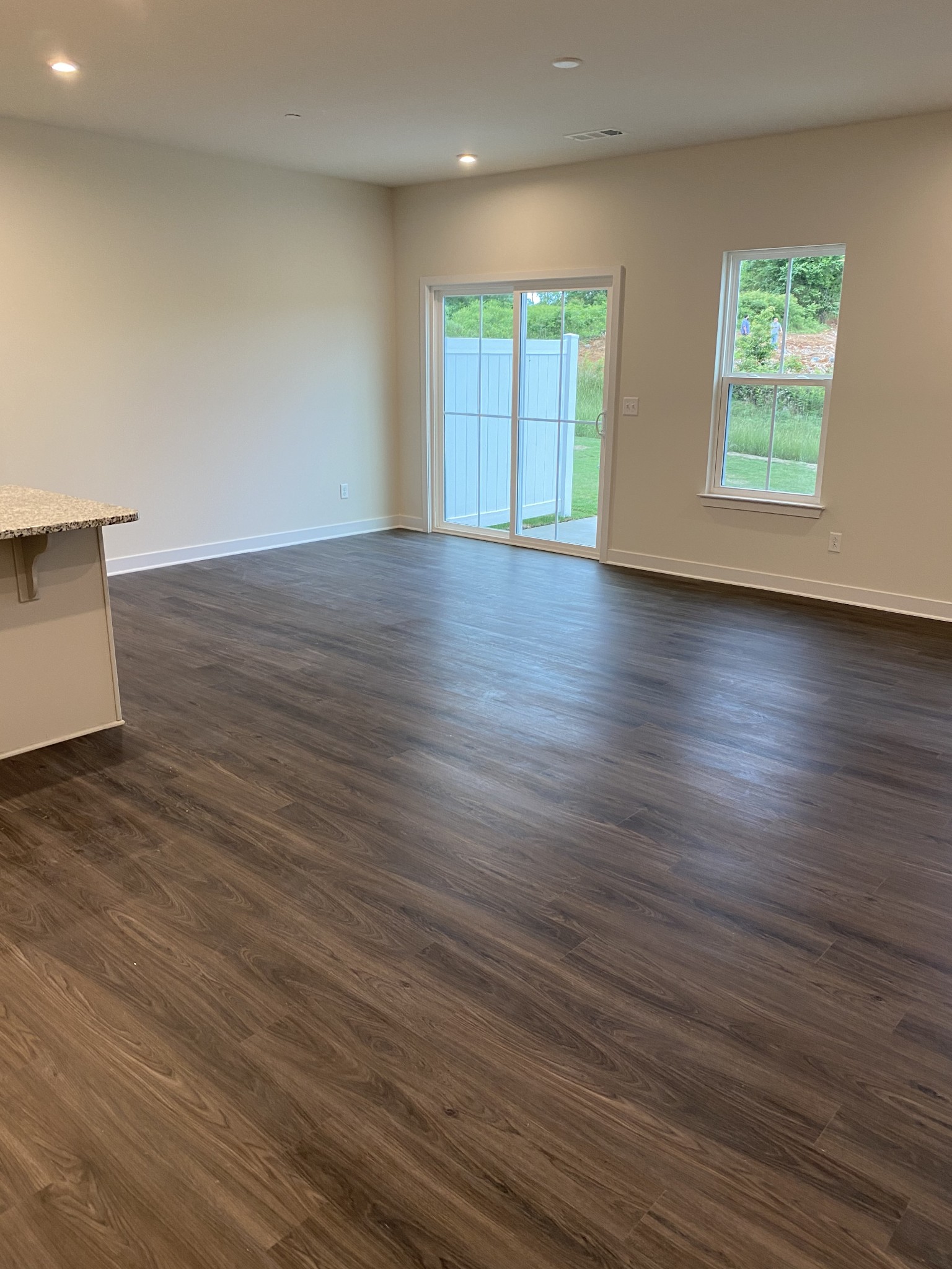 110 Keelon Gap Road, Unit 104C Spring Hill, TN 37174 - Photo 10 of 22 a view of an empty room with wooden floor and a window