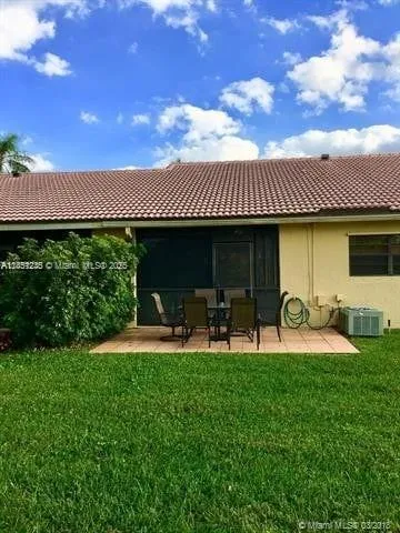 a front view of a house with garden and porch