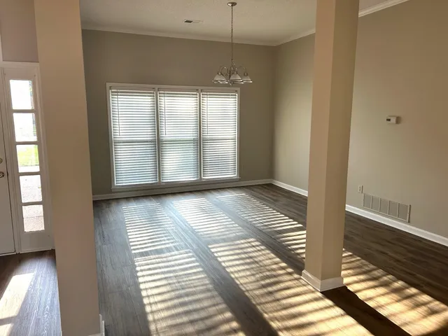 a view of a livingroom with wooden floor