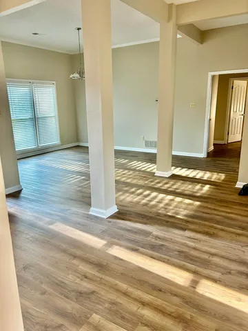 a view of an empty room and a fireplace