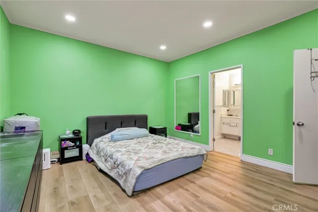 a bedroom with a bed and a table