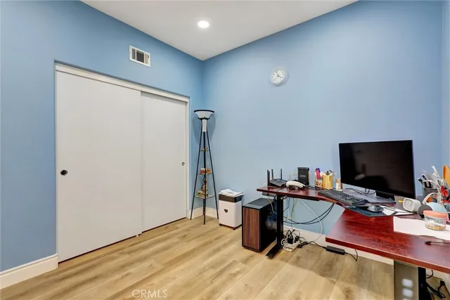 a view of a workspace with furniture