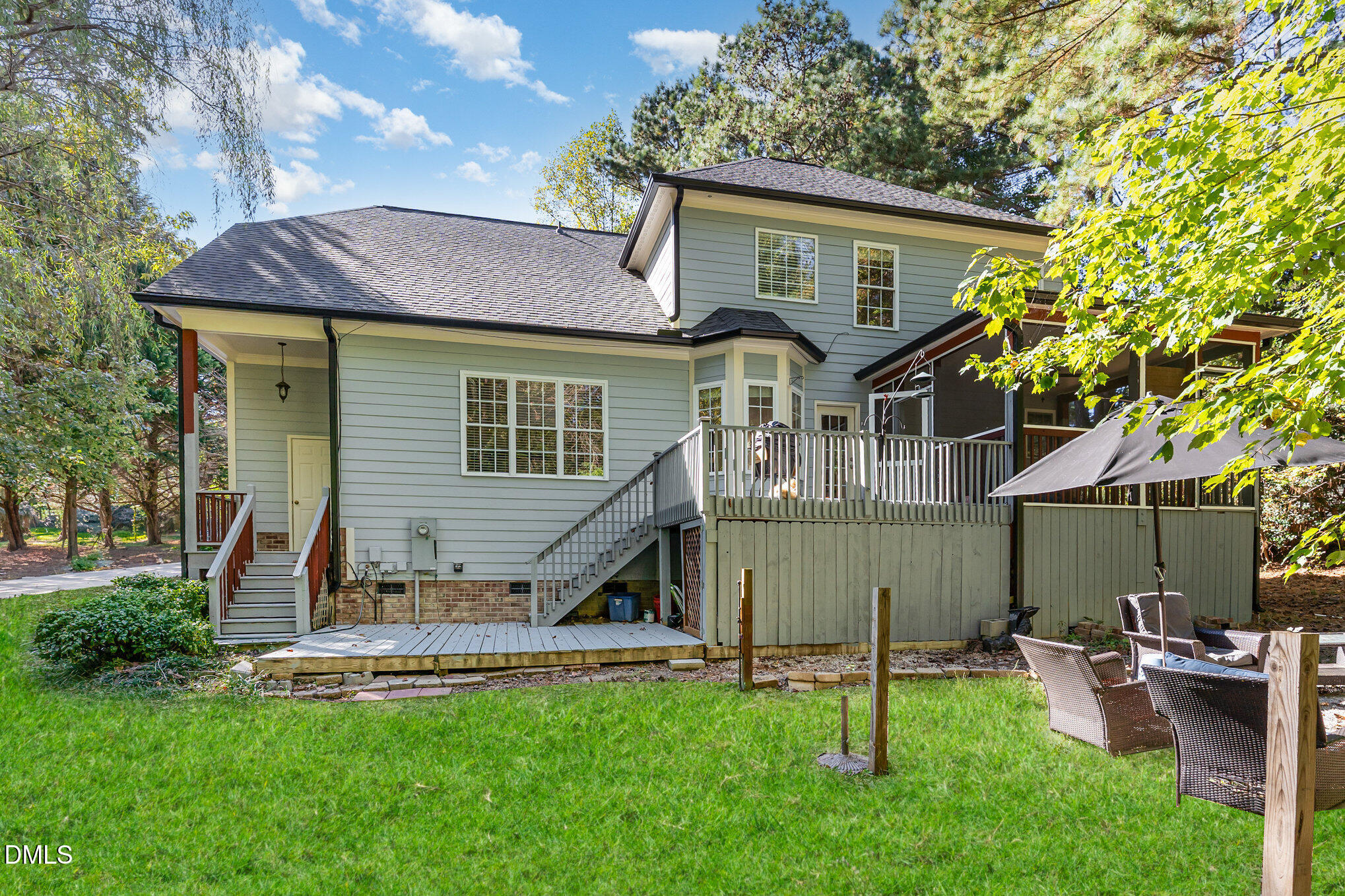 4613 Cherrybark Lane Raleigh, NC 27616 - Photo 21 of 27 a view of a house with a yard patio and a garden