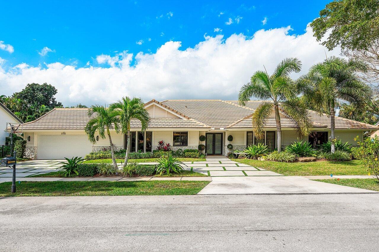 3765 Kings Way Boca Raton, FL 33434 - Photo 1 of 60 a front view of house with yard and green space