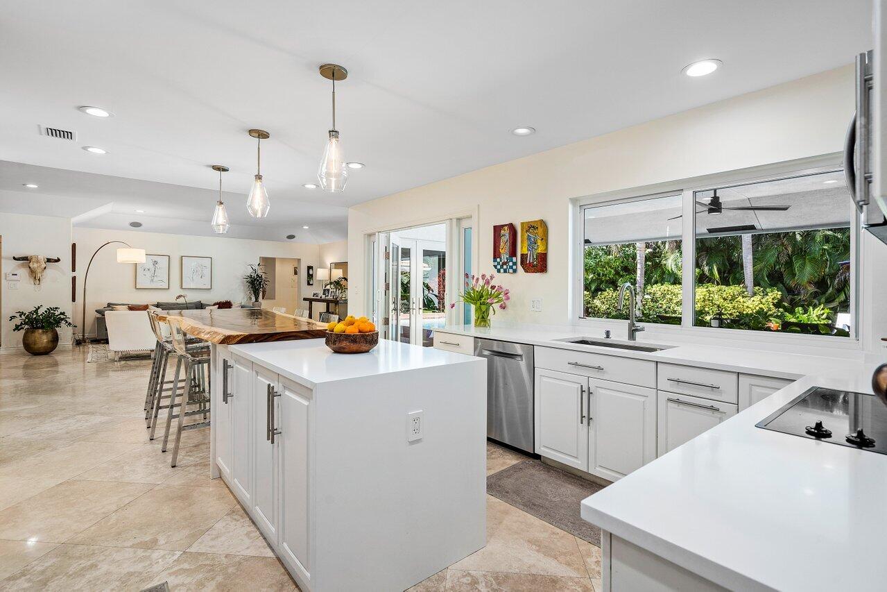 3765 Kings Way Boca Raton, FL 33434 - Photo 12 of 60 a kitchen that has a lot of cabinets in it and appliances